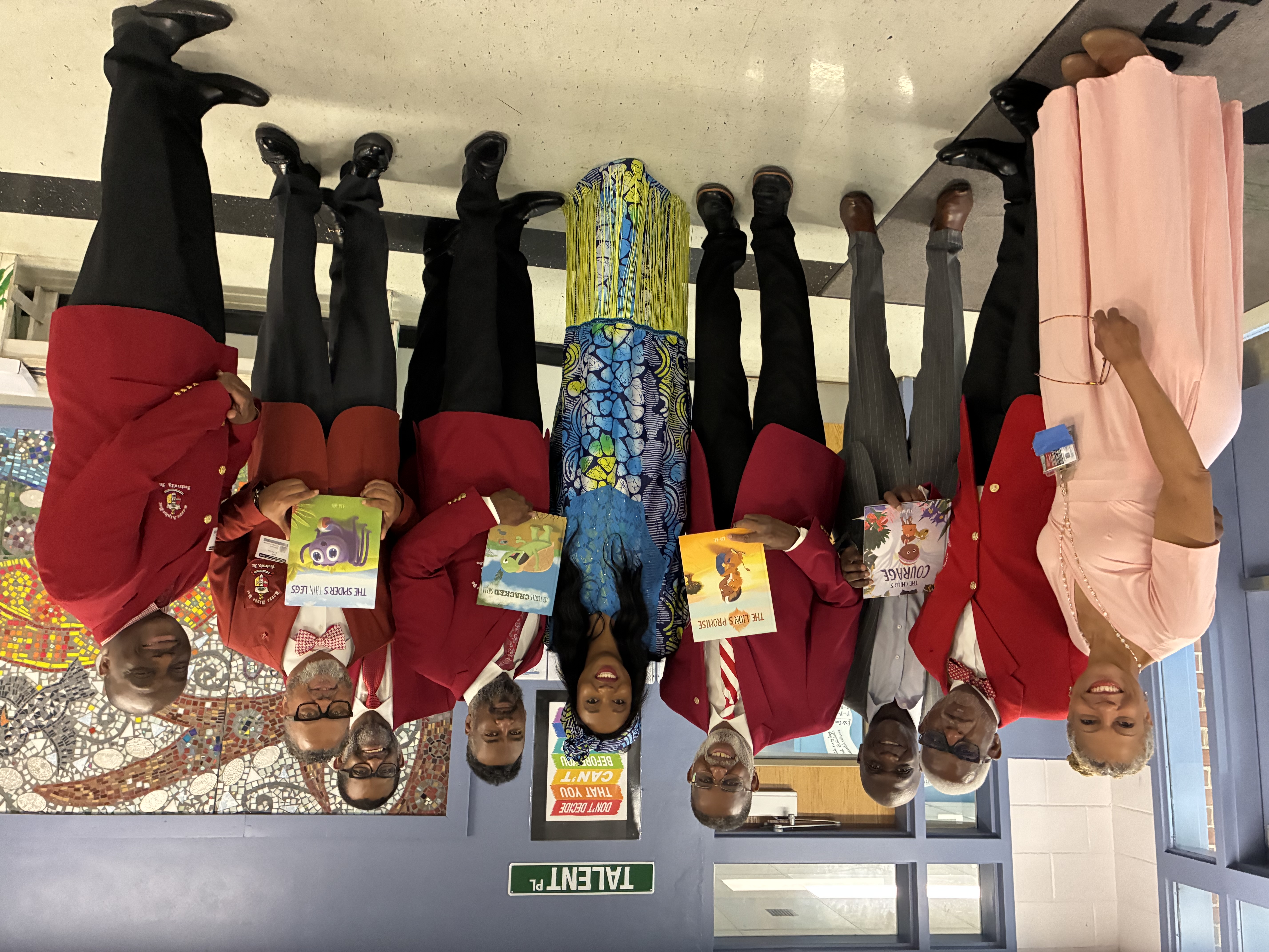 Chapter members presenting books to students